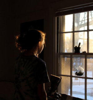 Woman looking out of a window